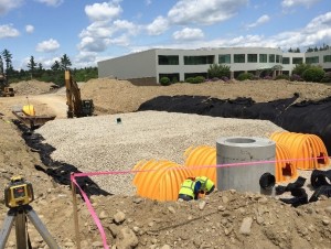 Contractors add stormwater controls as part of a parking lot expansion in Hudson, NH